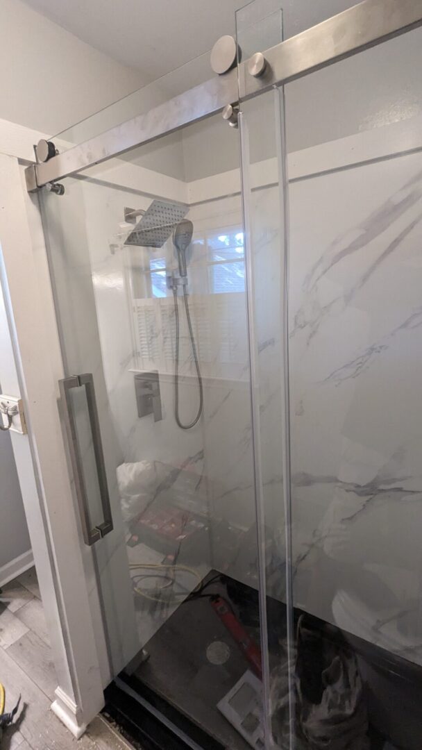 Modern shower with marble walls
