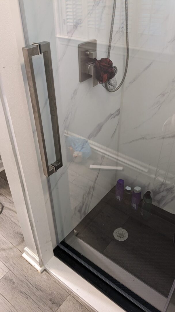 Bathroom shower interior with toiletries