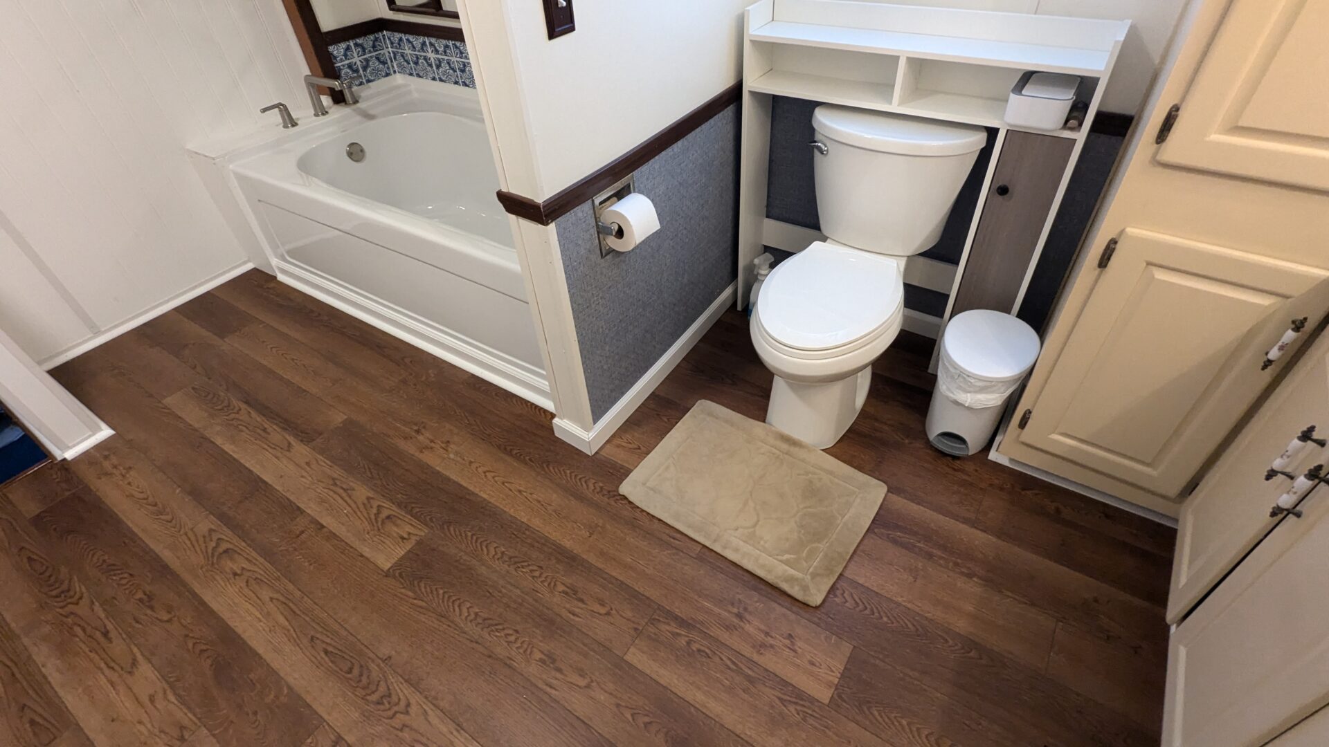 Modern bathroom featuring toilet and tub